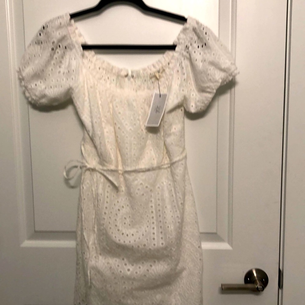 eyelet dress brand . States large however it would fit a medium size.